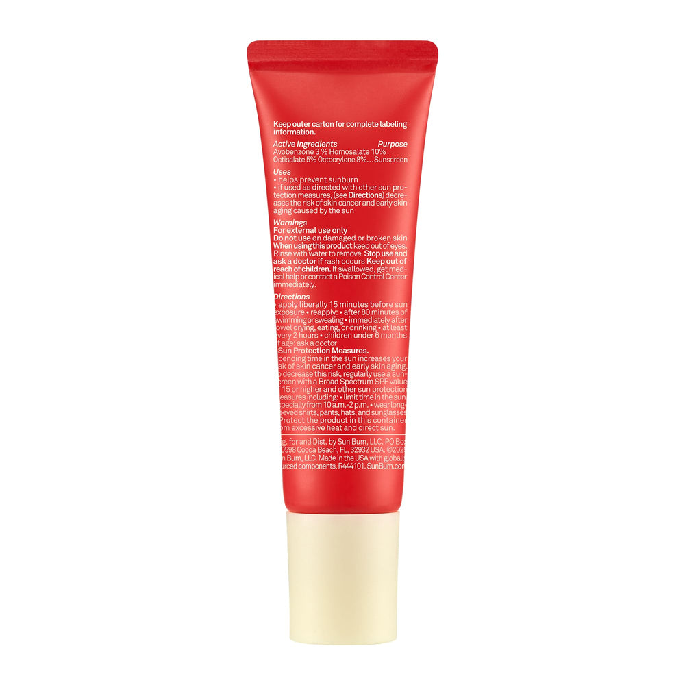 Sun Bum coconut sunscreen lip balm on beach scene