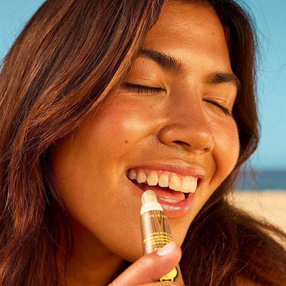 Pocket-size Sun Bum lip balm tucked in a bag.