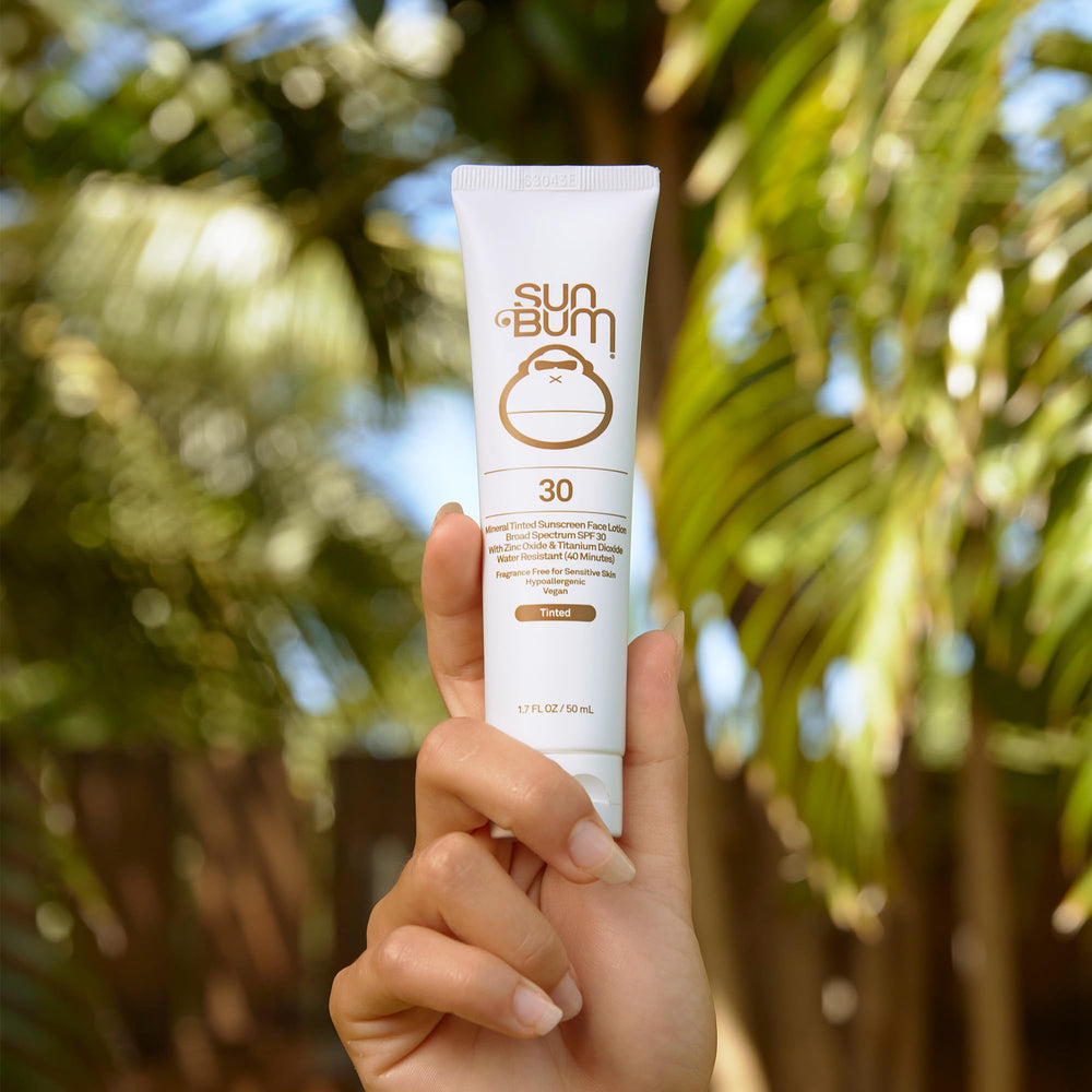 Sun Bum Mineral SPF 30 label in bright sunlight for visibility.