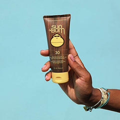 Sun Bum Original SPF 30 applying sunscreen on skin during outdoor activities.
