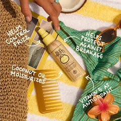 Applying Sun Bum leave-in conditioner to hair for smoother results