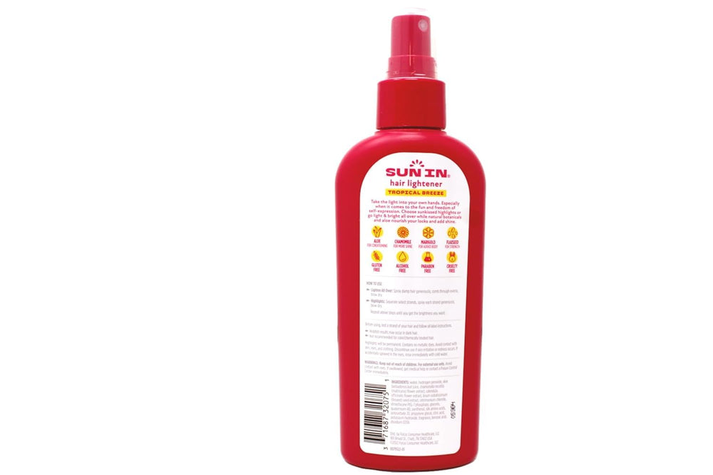 Sun-In Tropical Breeze mist being applied to damp hair before drying