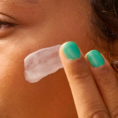 Sun Bum lotion being applied, spreads easily with a light, non-greasy feel.