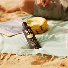 Sun Bum Browning Lotion being tested for water resistance on skin.