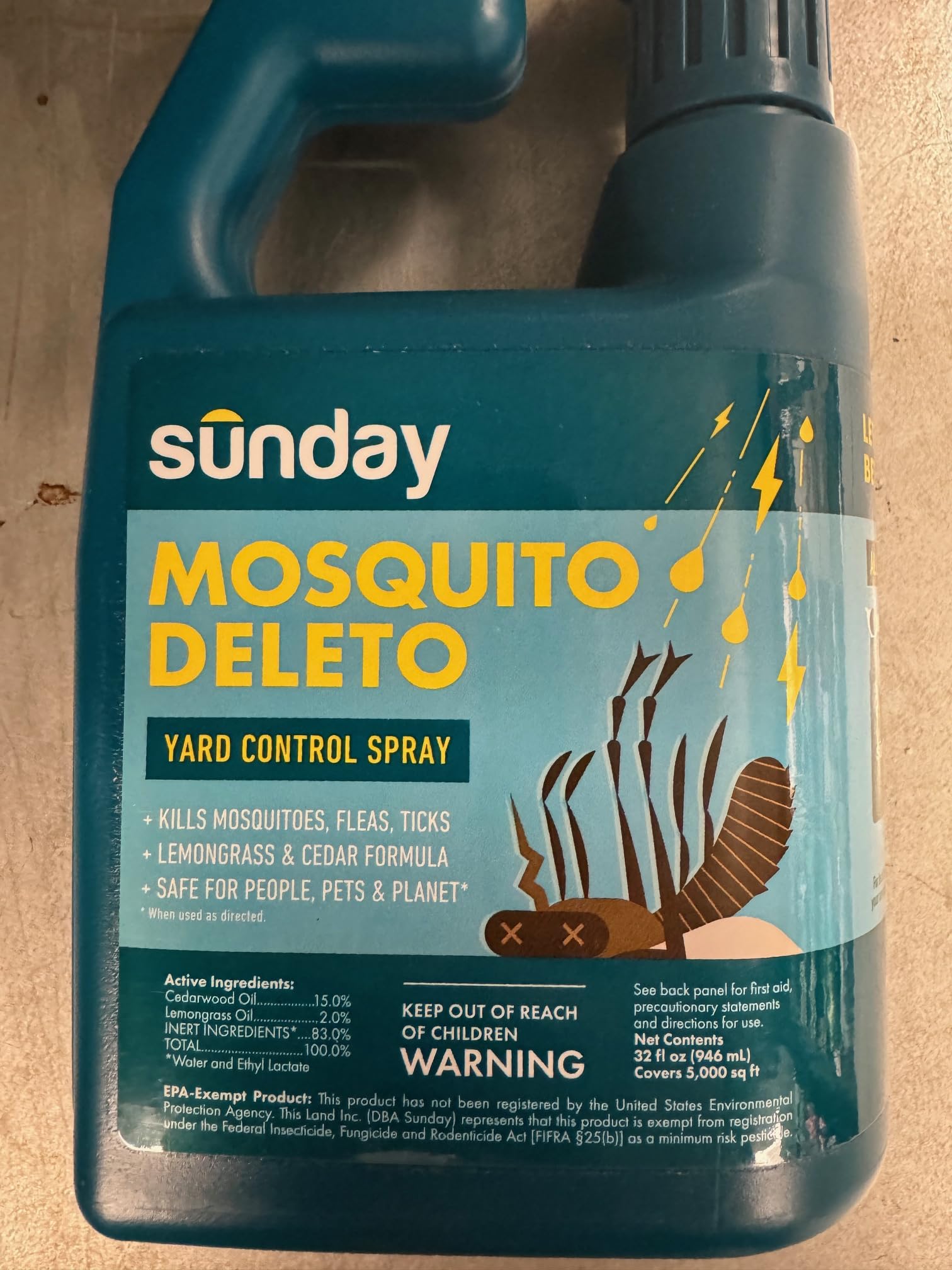 Sunday Mosquito Deleto hose on sprayer in action near greenery.