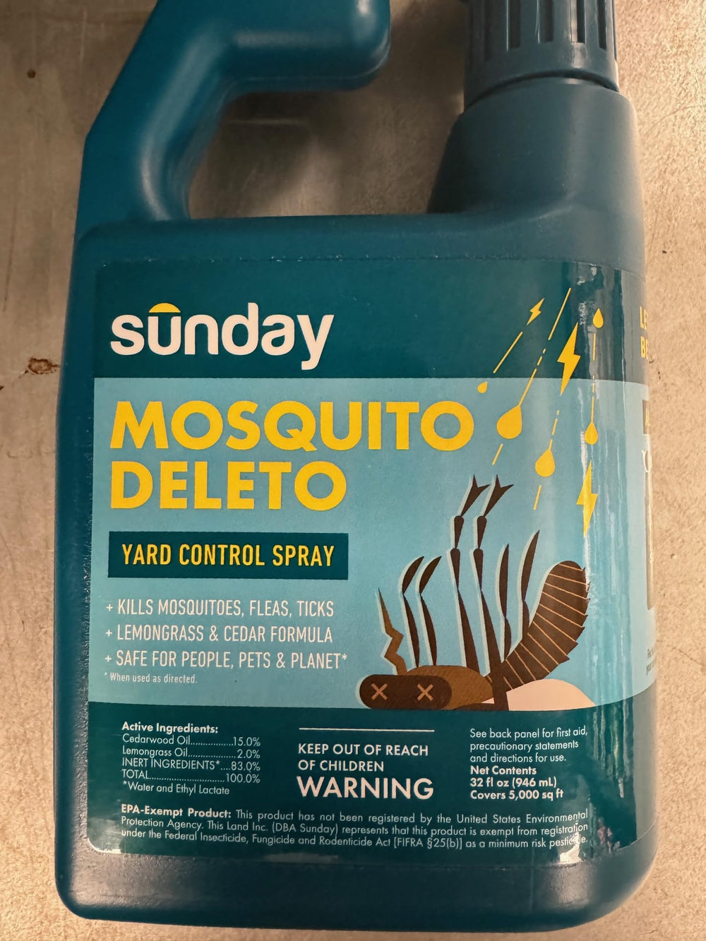 Sunday Mosquito Deleto hose on sprayer in action near greenery.