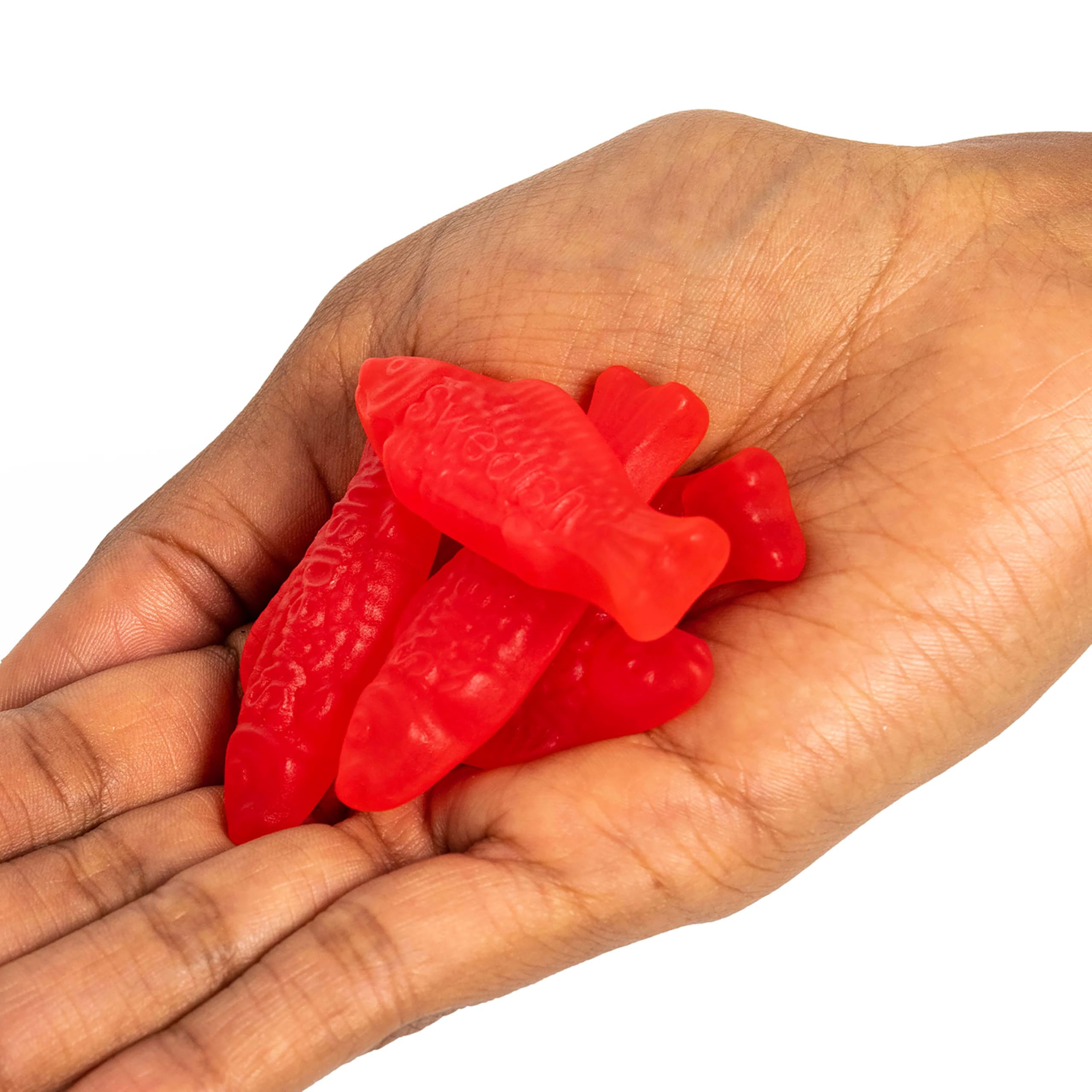 Swedish Fish family snacking image conveys shareable, fat-free candy option.