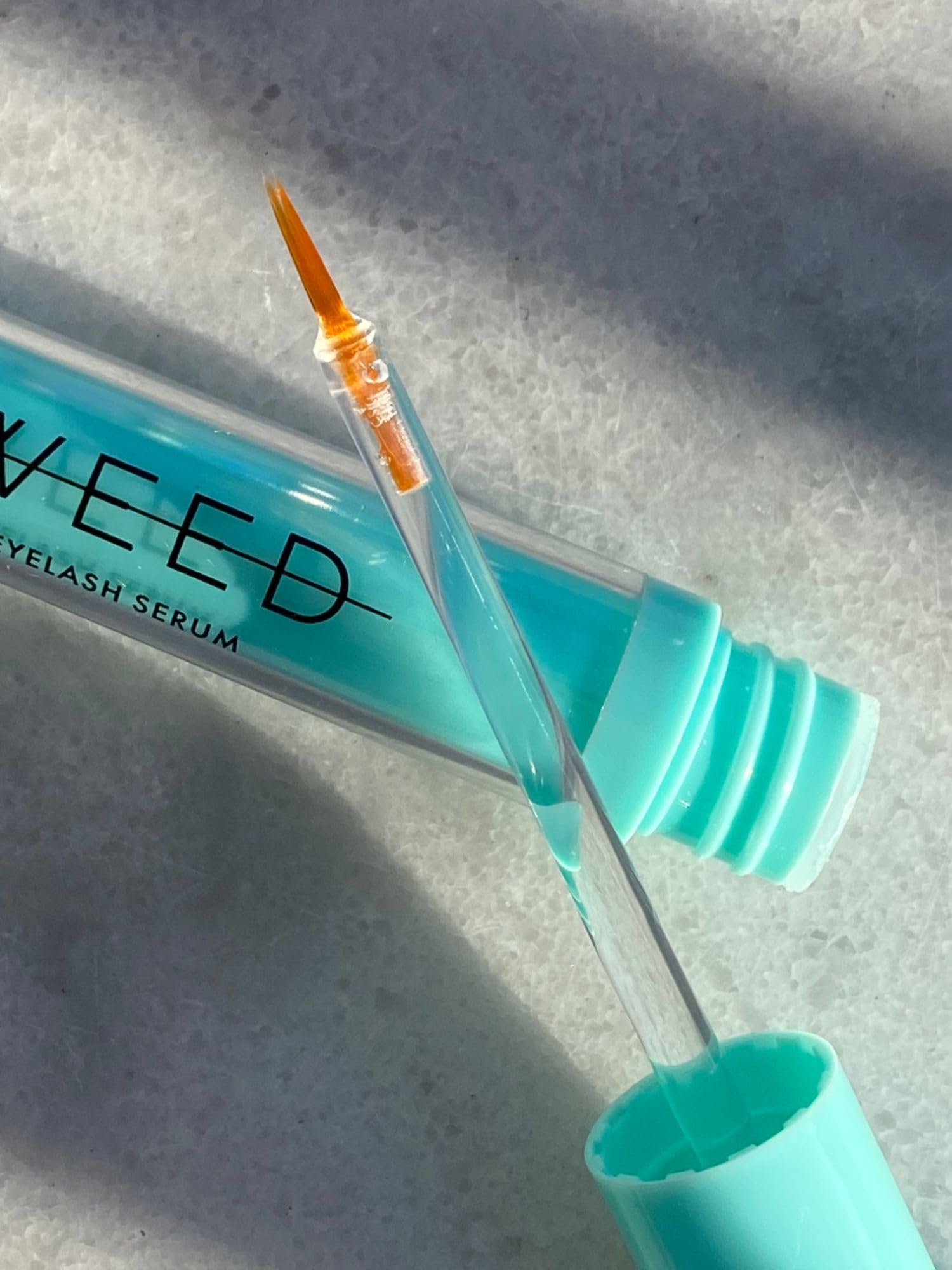 SWEED eyelash growth serum packaging displayed on clean surface