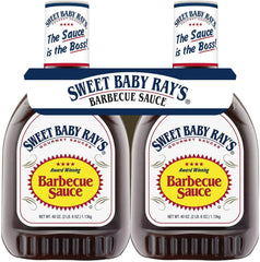 Sweet Baby Ray's barbecue sauce 40 oz bottle two-pack being poured for grilling.