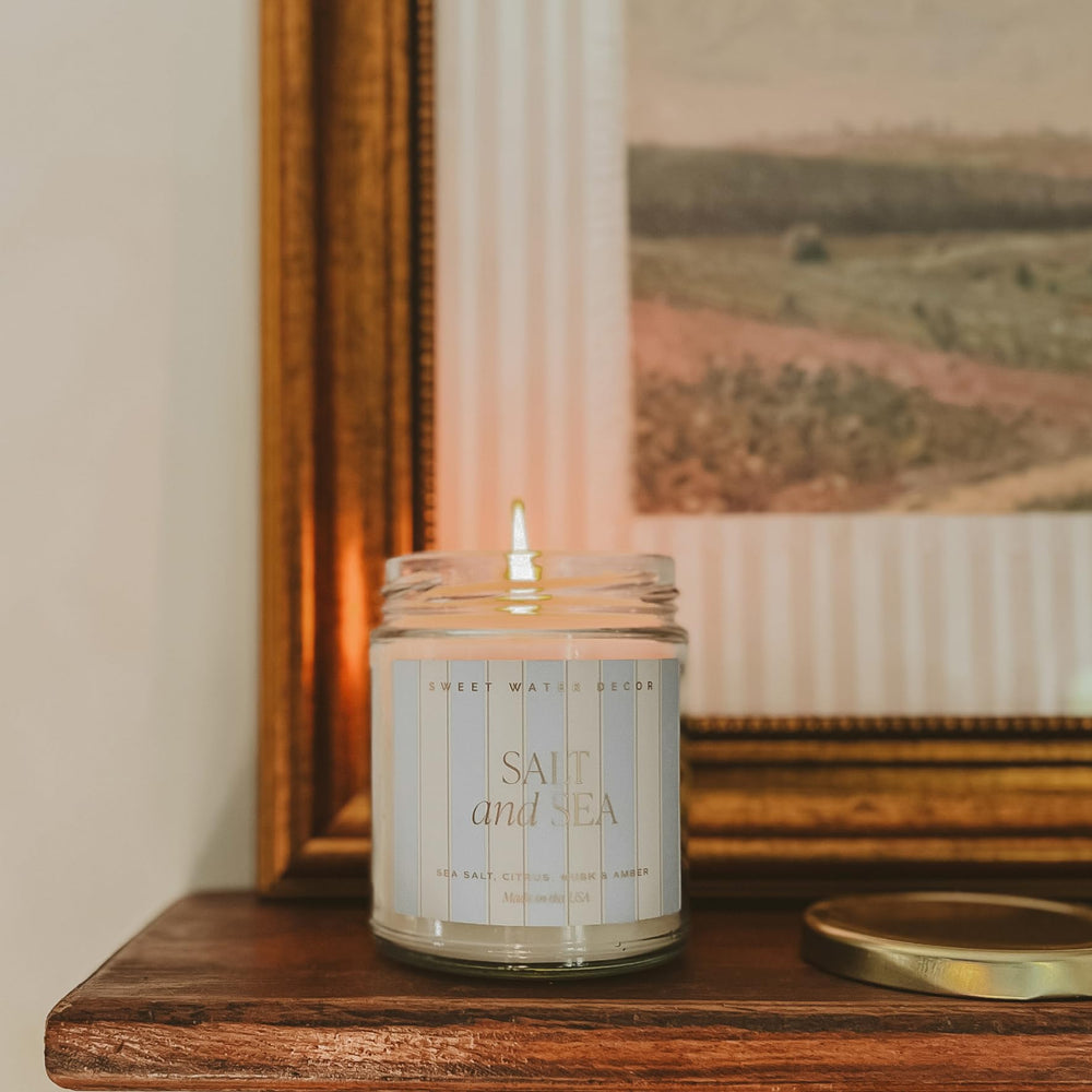 Sweet Water Decor candle on bathroom vanity offers spa-like freshness