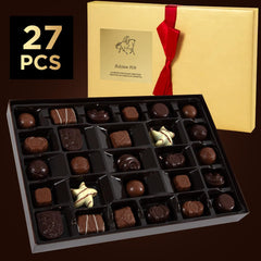 SWEETSIDE Candy Co. gift box with red ribbon presents elegant Belgian chocolates.