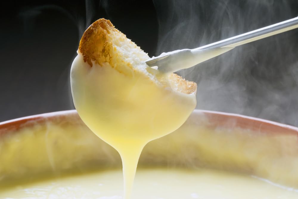 Stovetop fondue pot steaming, ready to heat in minutes.