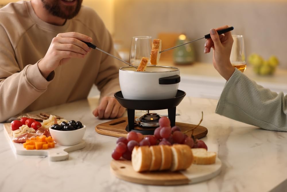 Elegant table setting with Swiss Knight fondue creates a cozy gathering.