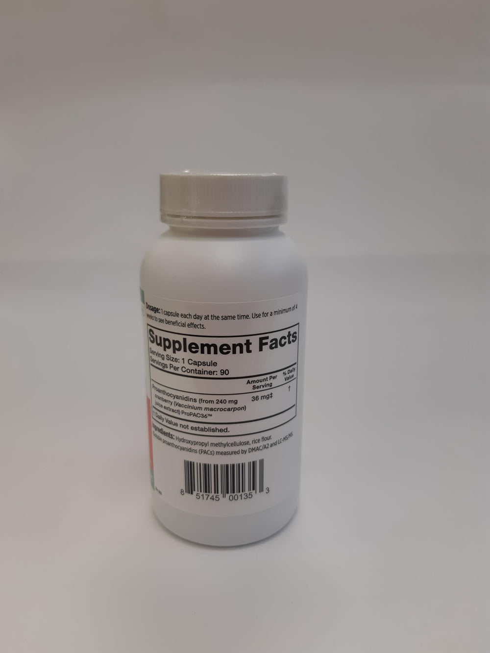 Szio+ Utiva Cranberry PACs capsule close-up showing small one a day size