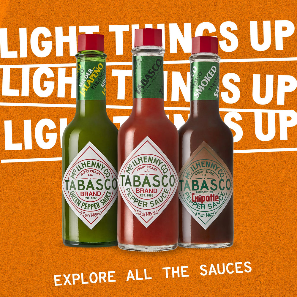 TABASCO glass bottle packaging displayed on kitchen counter.