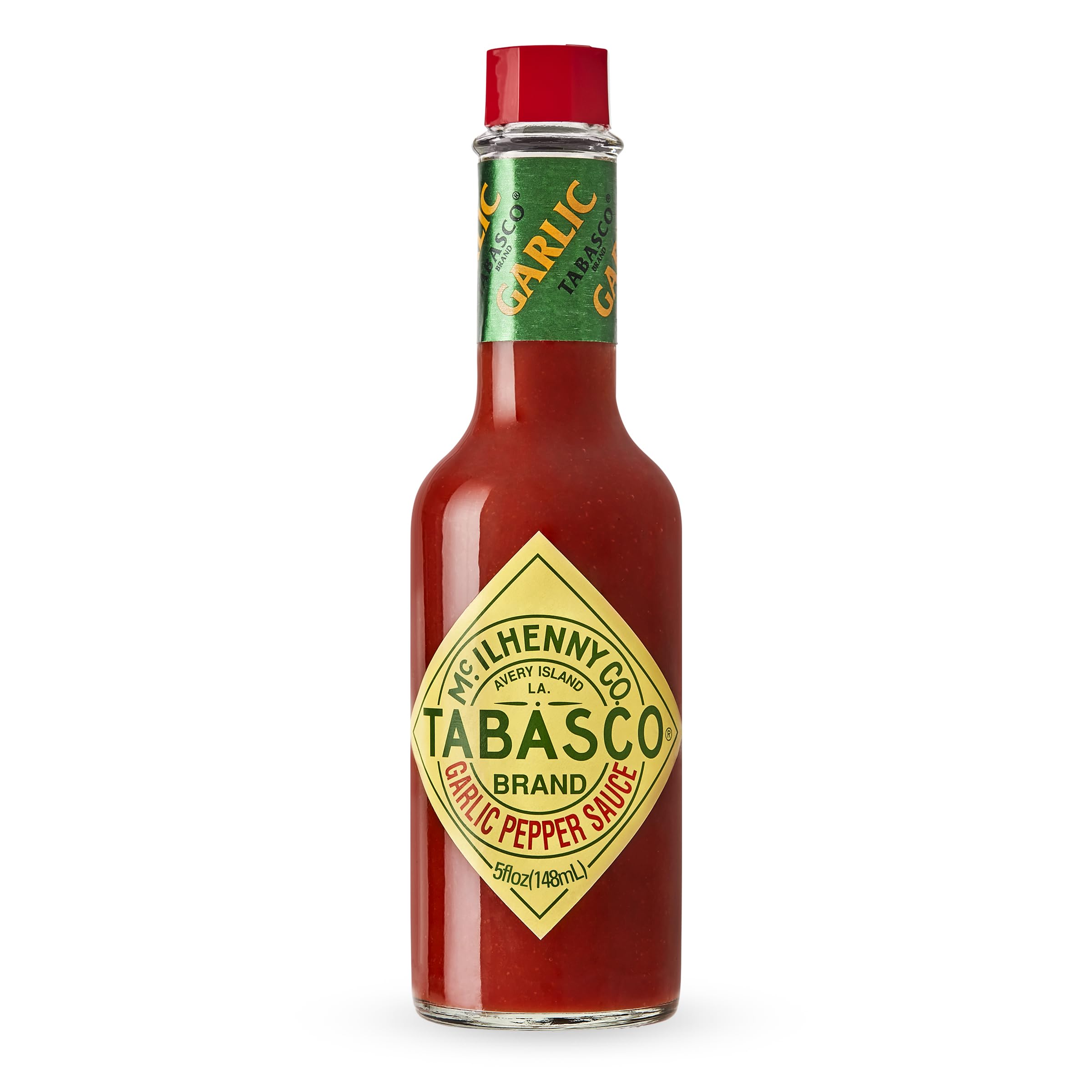 TABASCO Cayenne Garlic Pepper Sauce bottle on counter adds mild heat to meals.