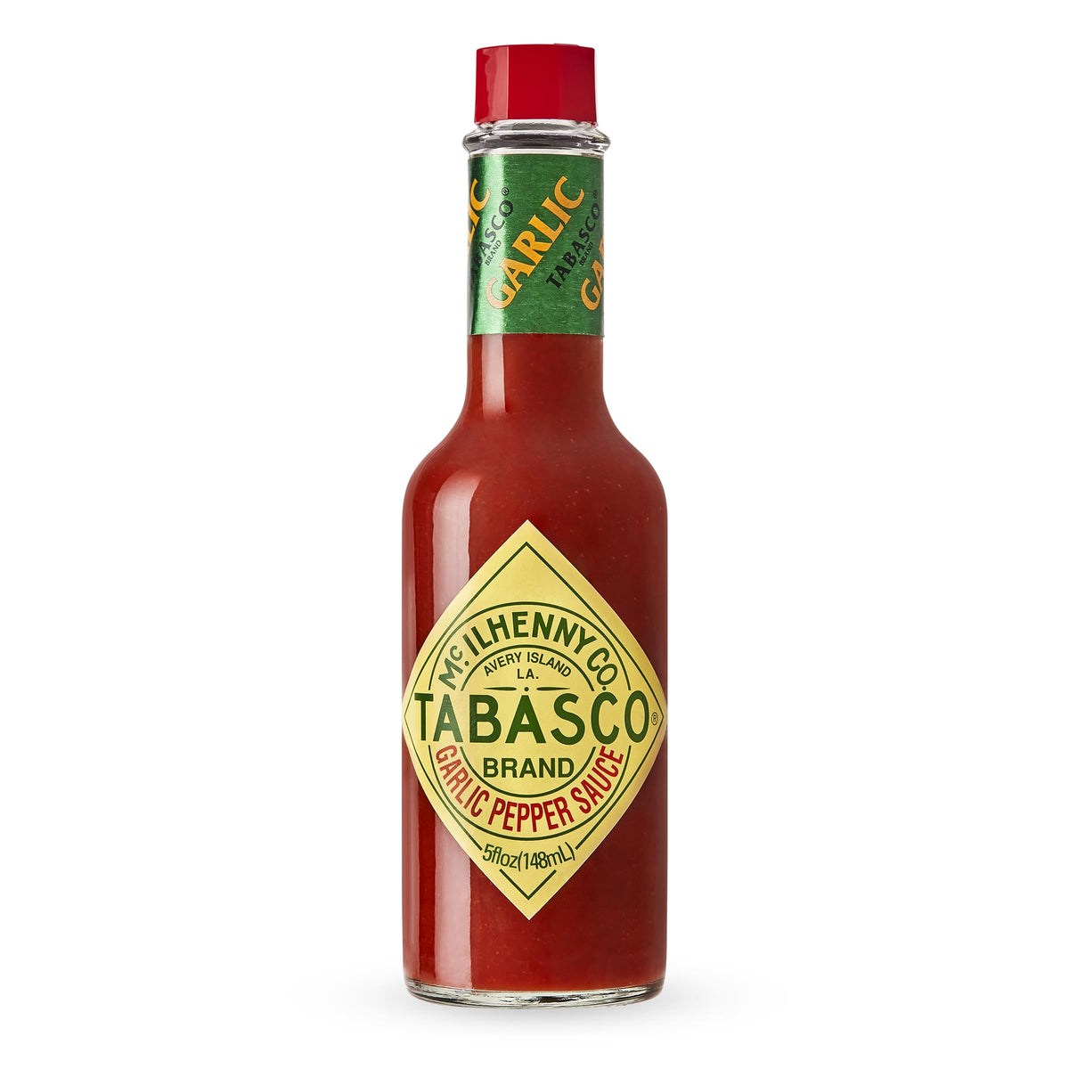 TABASCO Cayenne Garlic Pepper Sauce bottle on counter adds mild heat to meals.