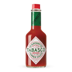 TABASCO Original Red bottle on shelf, a timeless pantry staple for bold flavor.
