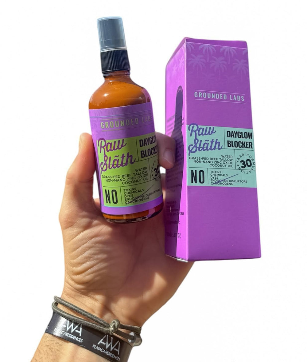 Grounded Labs sunblock at the beach scene implying reef-safe outdoor protection