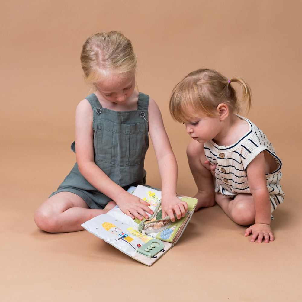 Taf Toys Busy Book supports early cognitive and motor development through engaging activities.