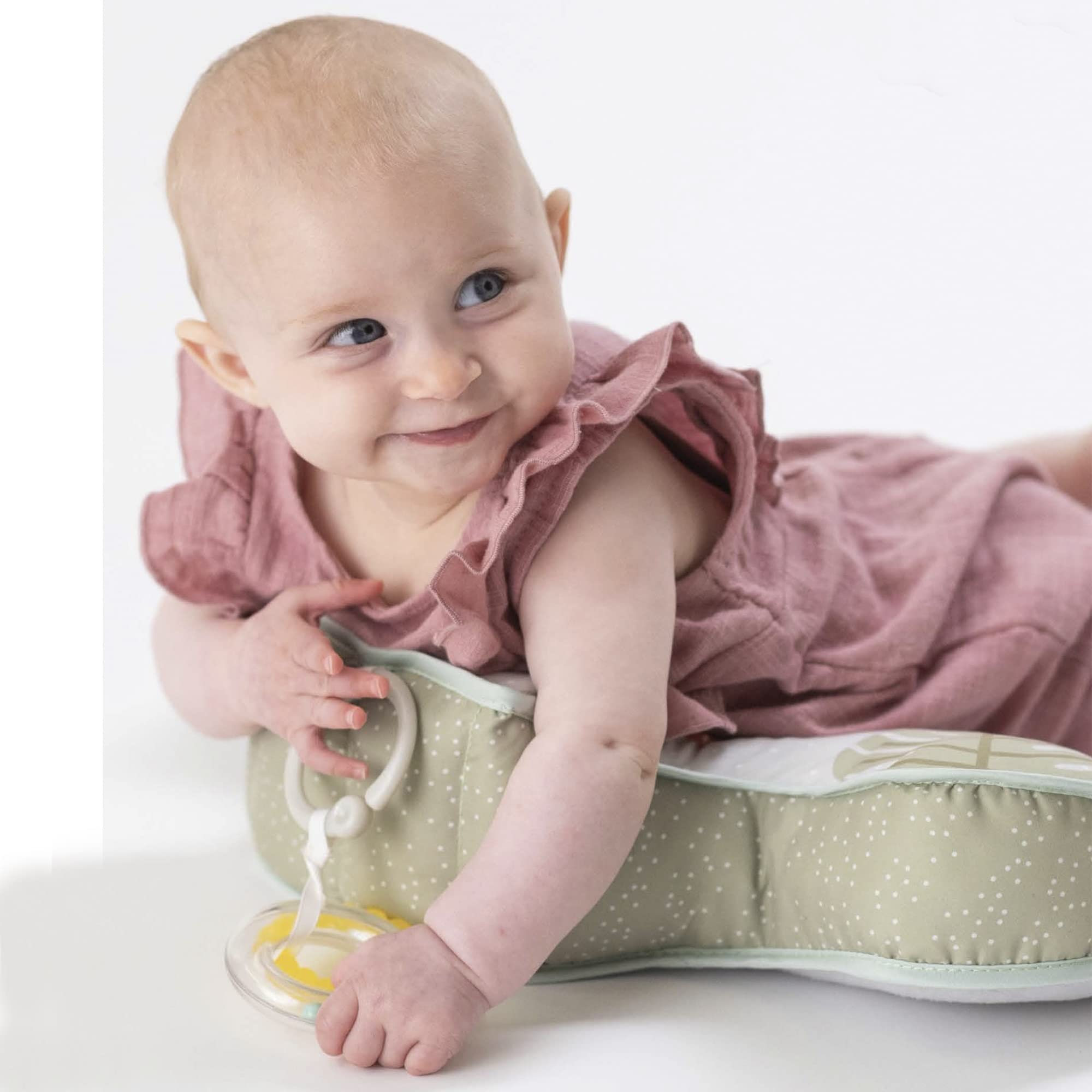 Detachable teether and rattle toys on Taf Toys tummy time support