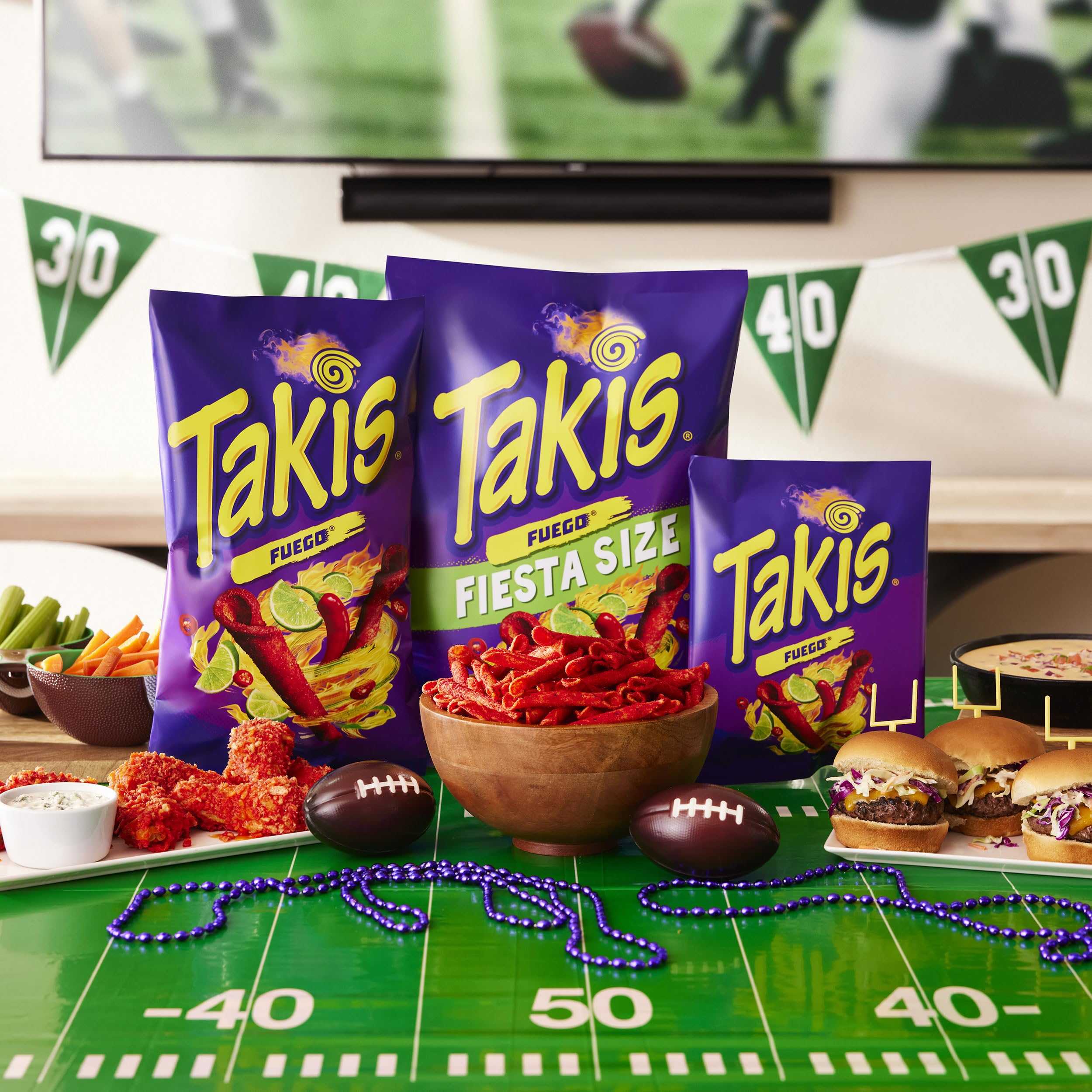 Takis Fuego party table setup invites sharing at gatherings and celebrations.
