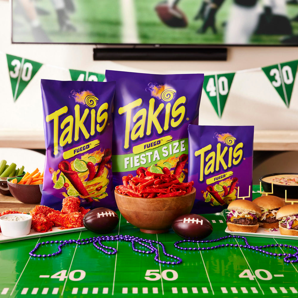 Takis Fuego party table setup invites sharing at gatherings and celebrations.