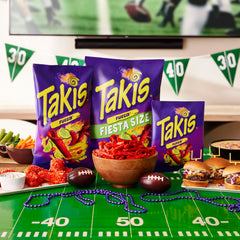 Takis Fuego party table setup invites sharing at gatherings and celebrations.
