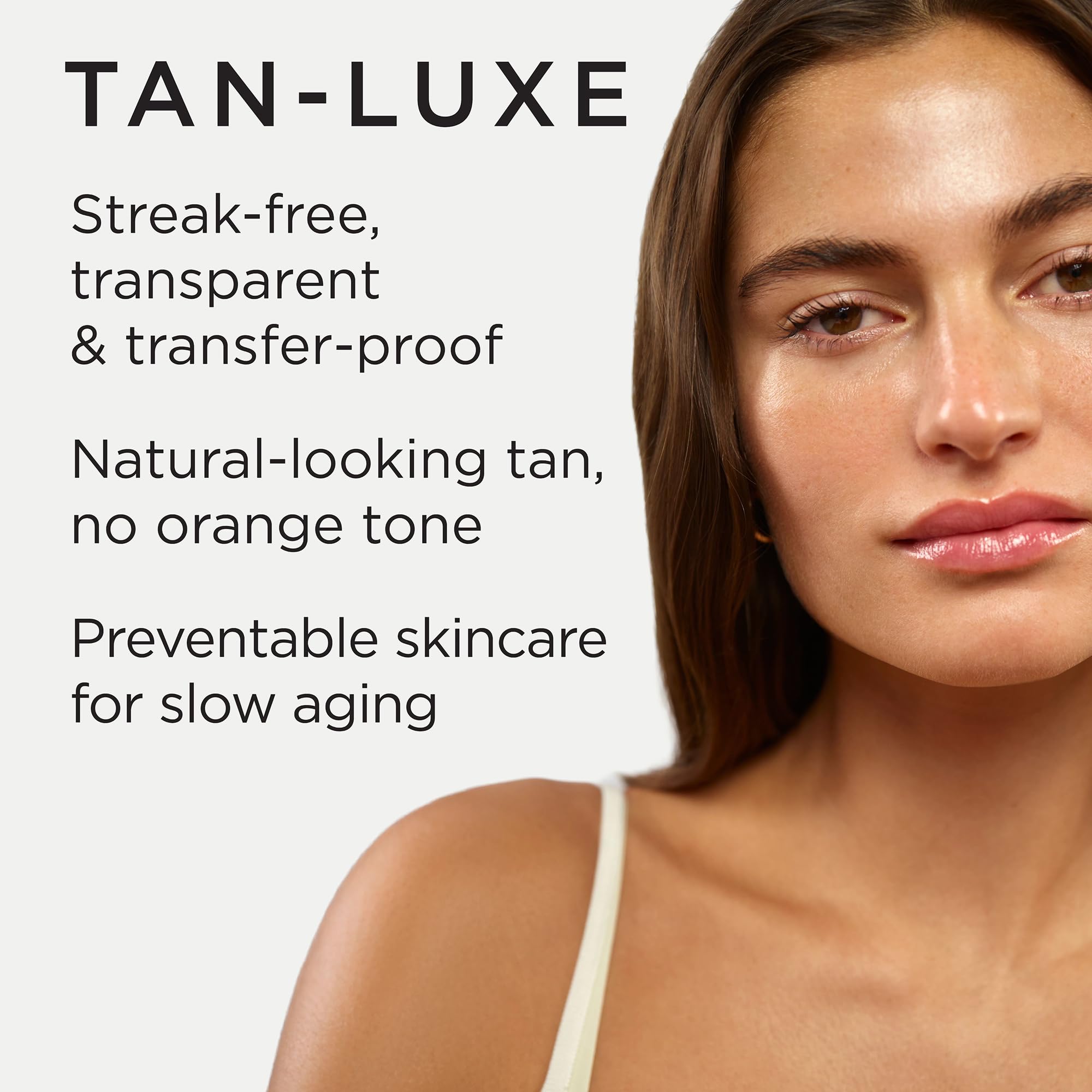 Tan-Luxe Gradual Illuminating Lotion hands applying to arm for even, streak-free glow.