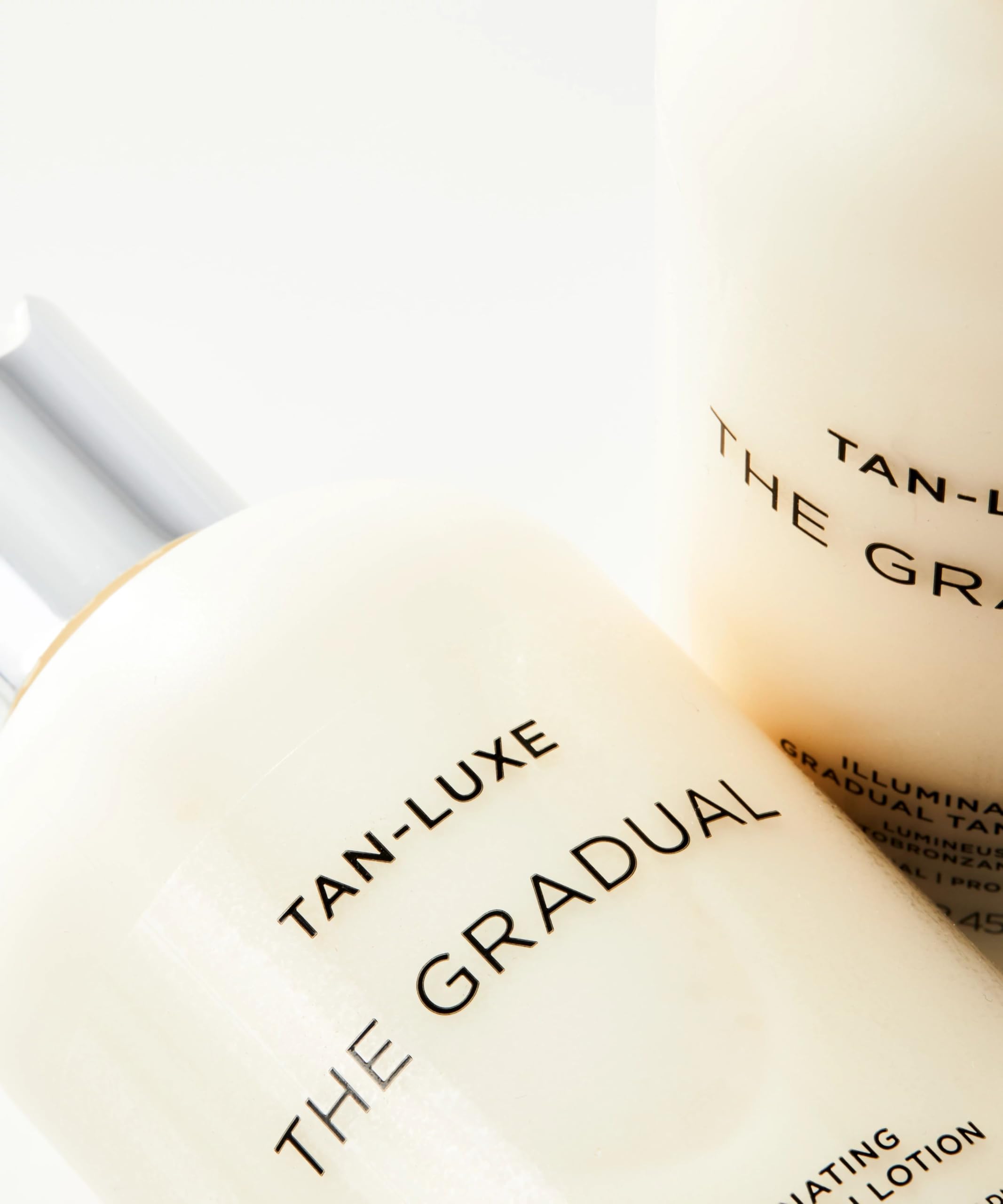 Tan-Luxe Gradual Illuminating Lotion vegan cruelty-free label on bottle.