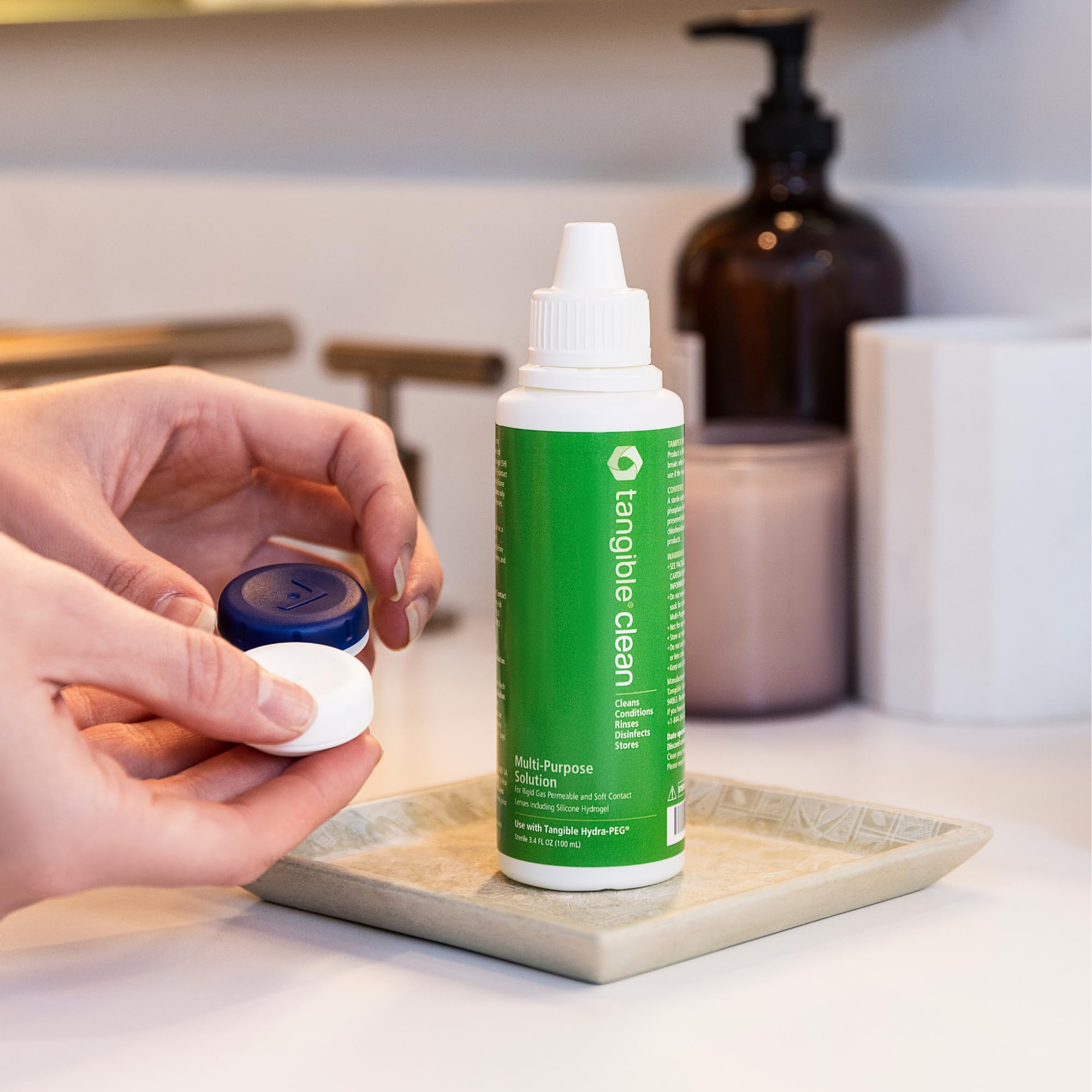 Tangible Clean travel-size packaging offers compact lens care on the move