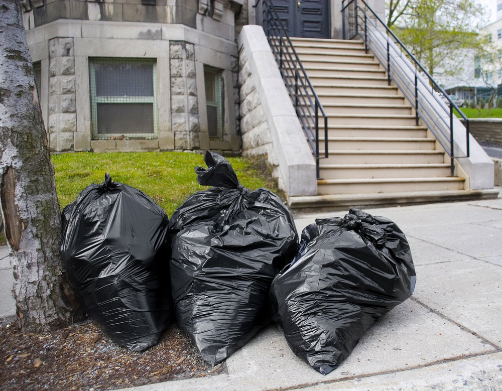 Tasker 65-gallon bags open from bulk pack for easy setup.