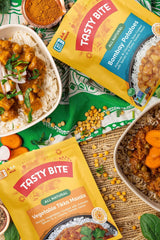 Tasty Bite Vegetable Tikka Masala cup highlighting creamy tomato sauce and plant-based ingredients.