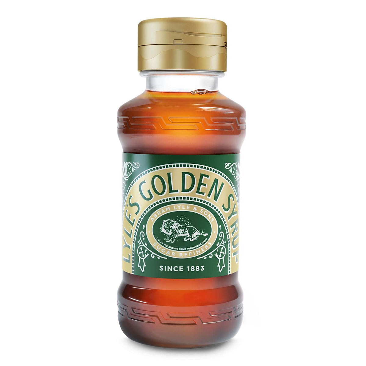 Lyle's Golden Syrup bottle being poured, perfect for rich desserts and baking.