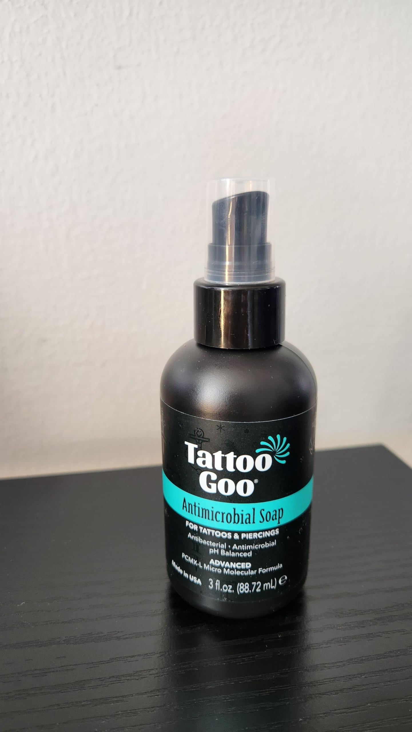 Tattoo Goo cleansing soap near tattoo or piercings area