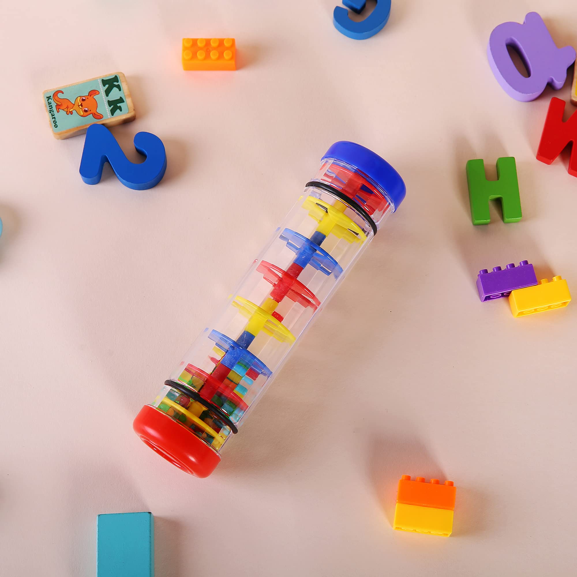 Bright beads travel through the rain stick, engaging rhythm play