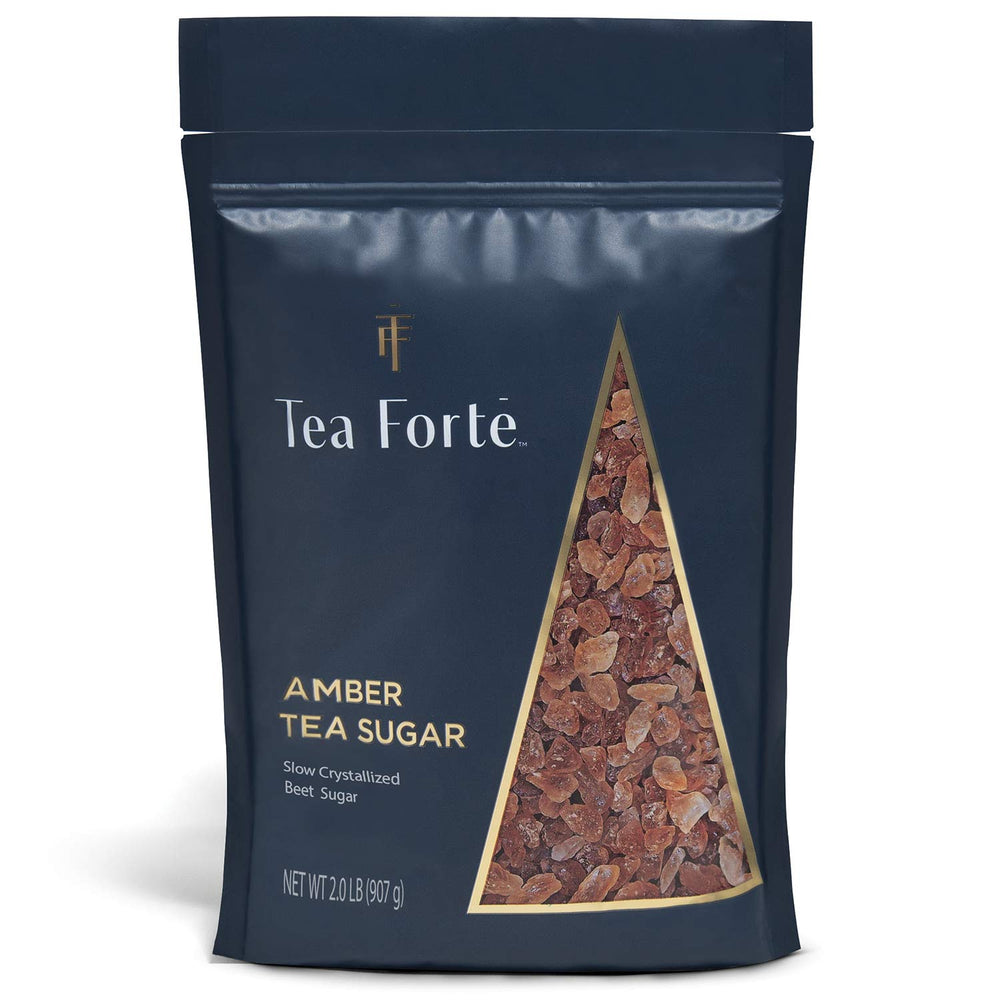 Tea Forte amber hue beet sugar crystals dissolving in tea