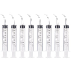TecUnite 8-pack syringe with curved tip reaching tight dental spaces for irrigation.