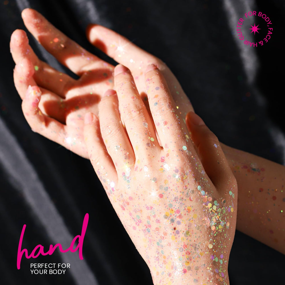 Teenitor body glitter on arm under lights for radiant glow.