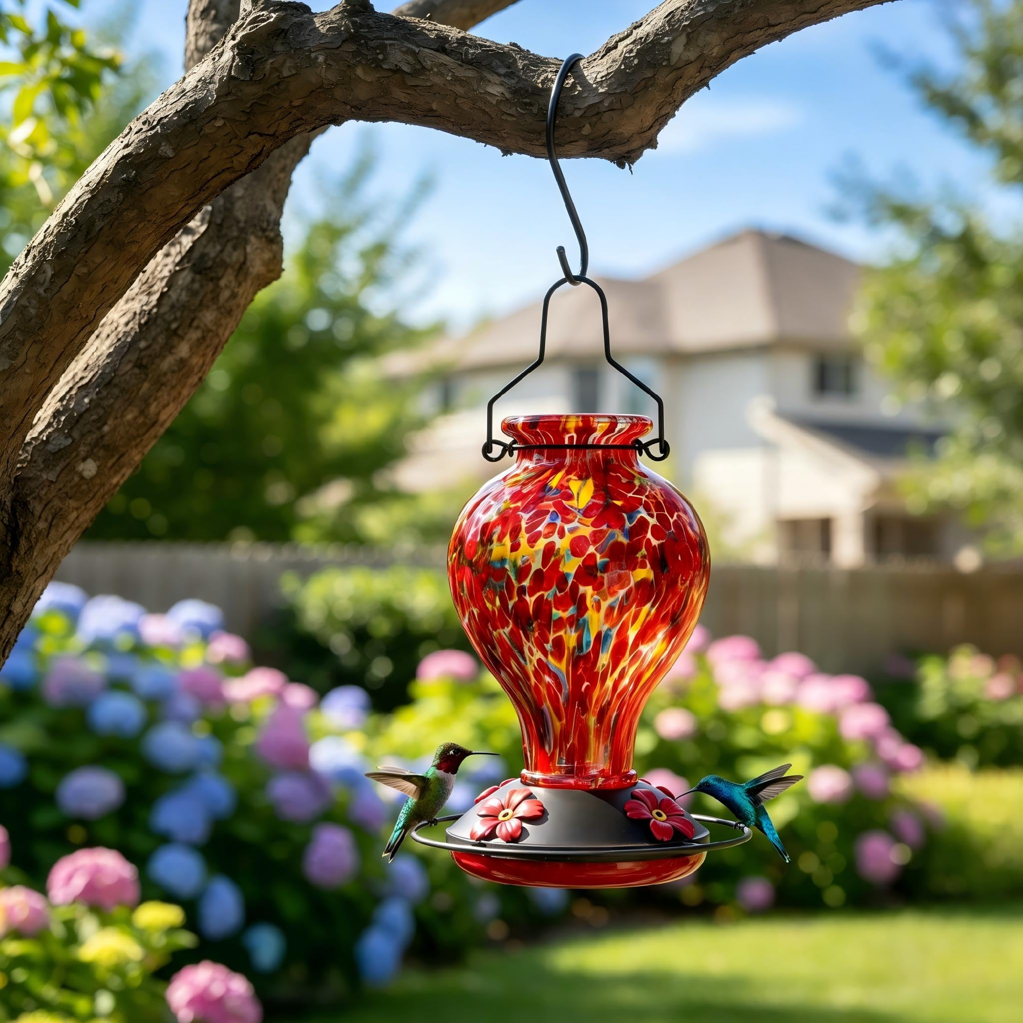 Tegarbed hummingbird feeder hand-blown glass texture close-up.