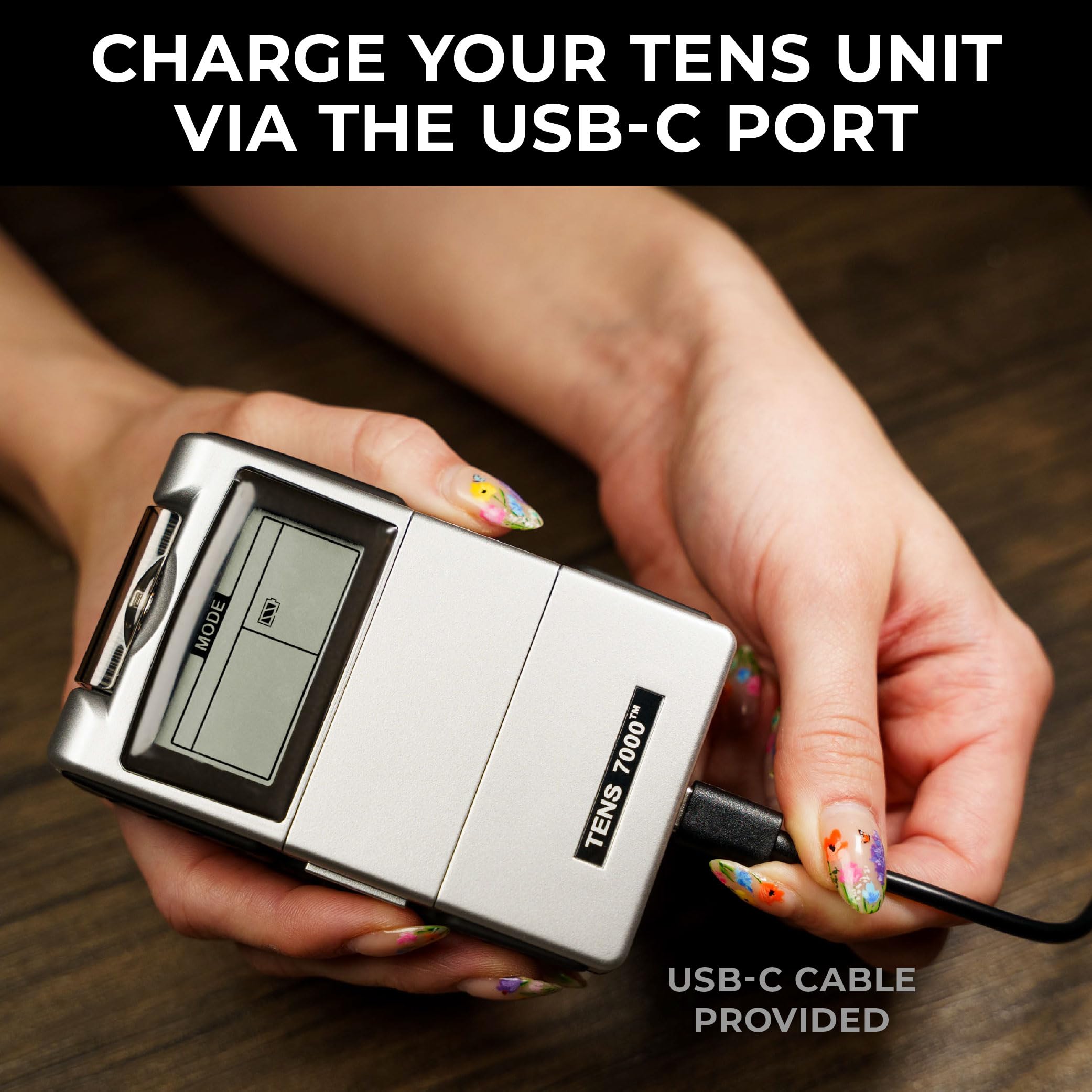 TENS 7000 charging dock showing rechargeable setup for uninterrupted therapy