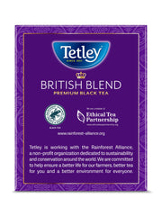 Pouring Tetley British Blend tea with visible steam and aroma.