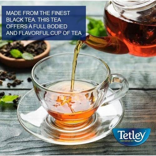Tetley cup with tea steeping, ideal for cozy breaks.