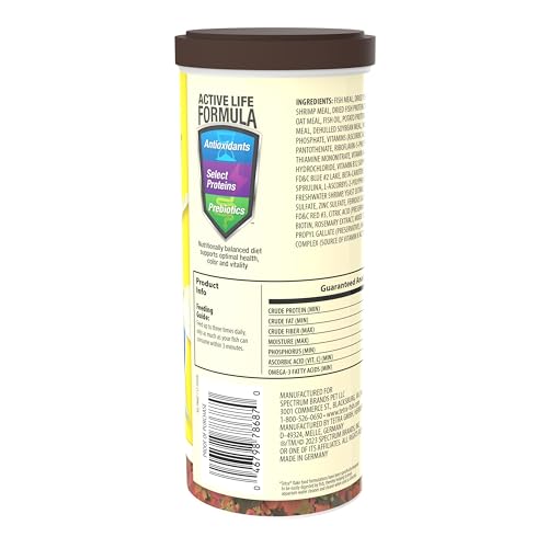 TetraMin Tropical Flakes close-up emphasizes easily digested flakes for cleaner water.