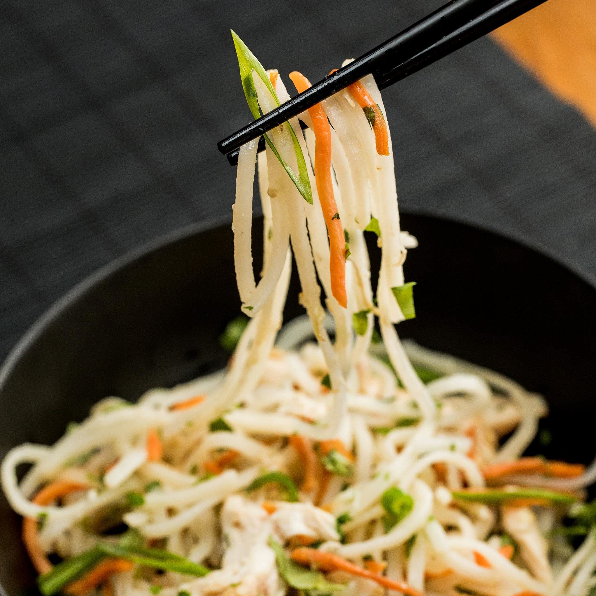 Thai Kitchen rice noodles displayed for steamed texture in bowls.