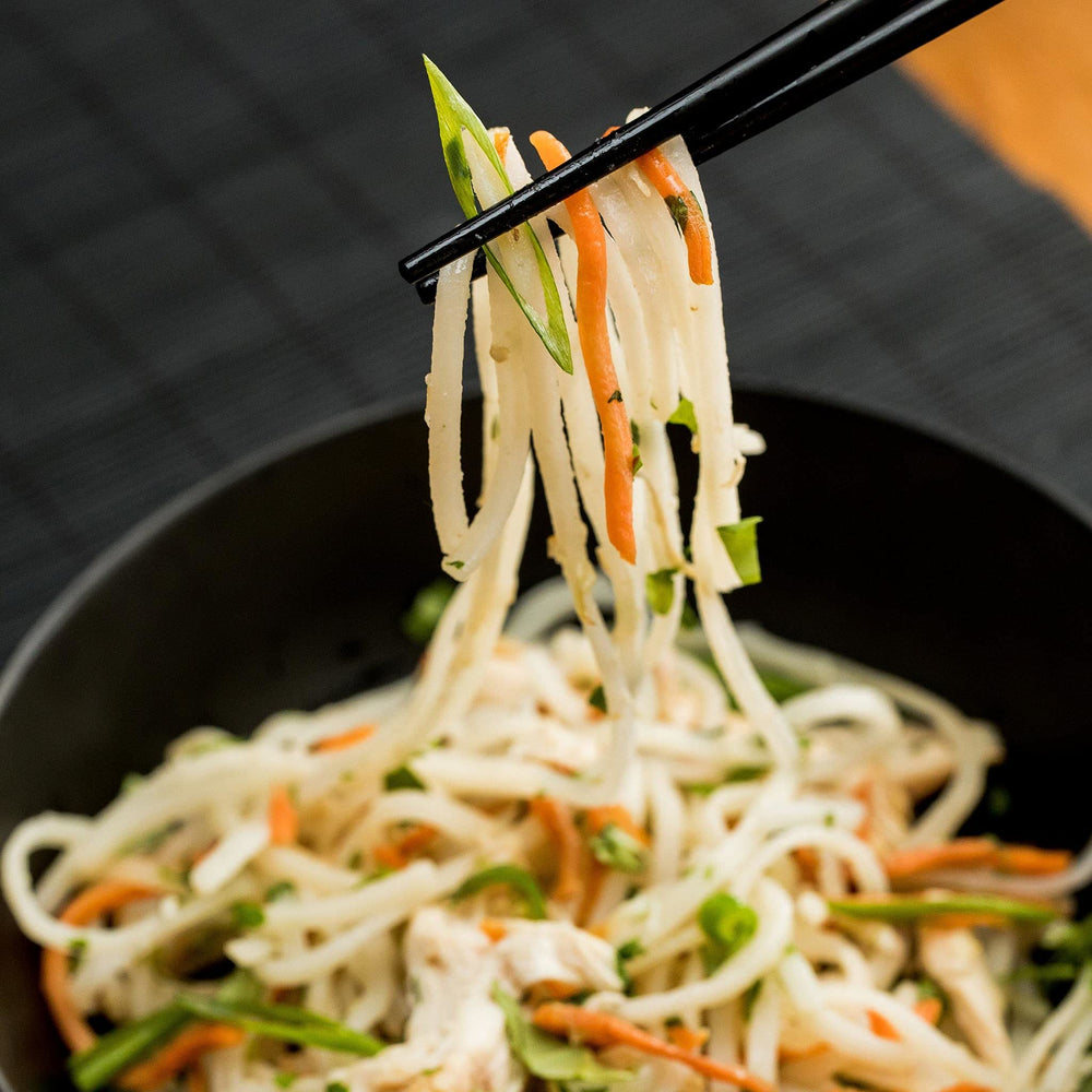 Thai Kitchen rice noodles displayed for steamed texture in bowls.