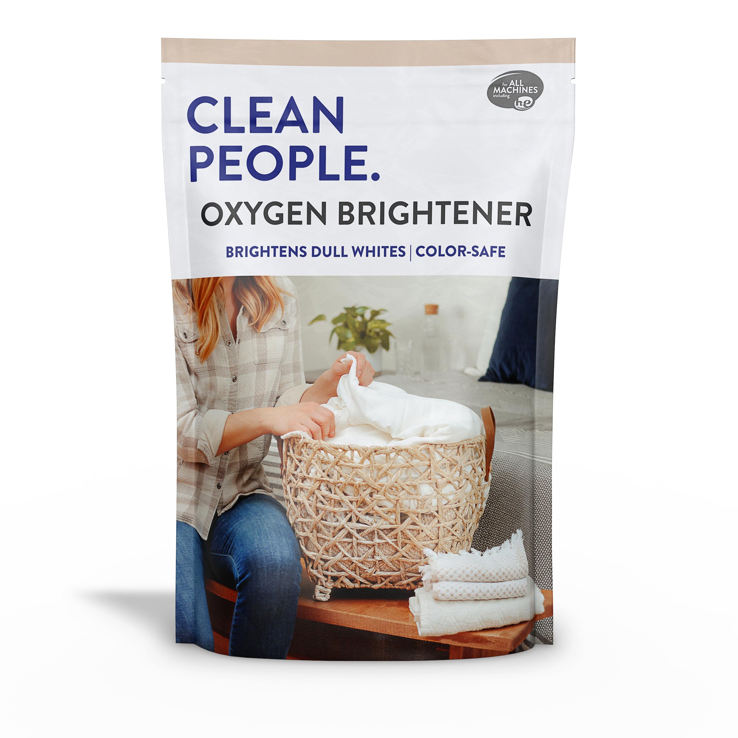 The Clean People Oxygen Brightener bottle pour showing chlorine-free whitening action.