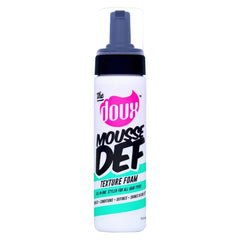 The Doux Multi-Use Mousse bottle close-up for smooth, frizz-free curls.