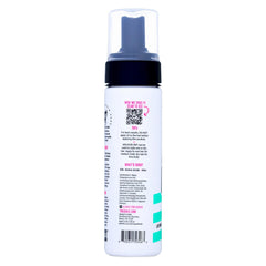 The Doux Mousse being applied to hair for easy styling and definition.