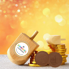 The Dreidel Company vibrant Hanukkah box showcasing gelt as a gift